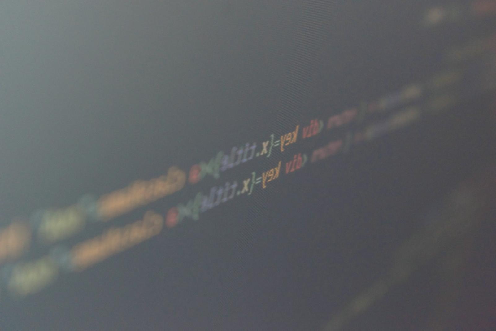 Advanced coding workspace showing multiple monitors with React development environment and debugging tools
