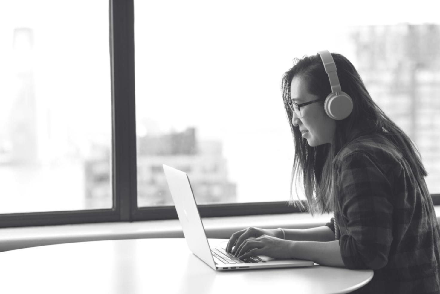 Modern development workspace with multiple monitors showing code