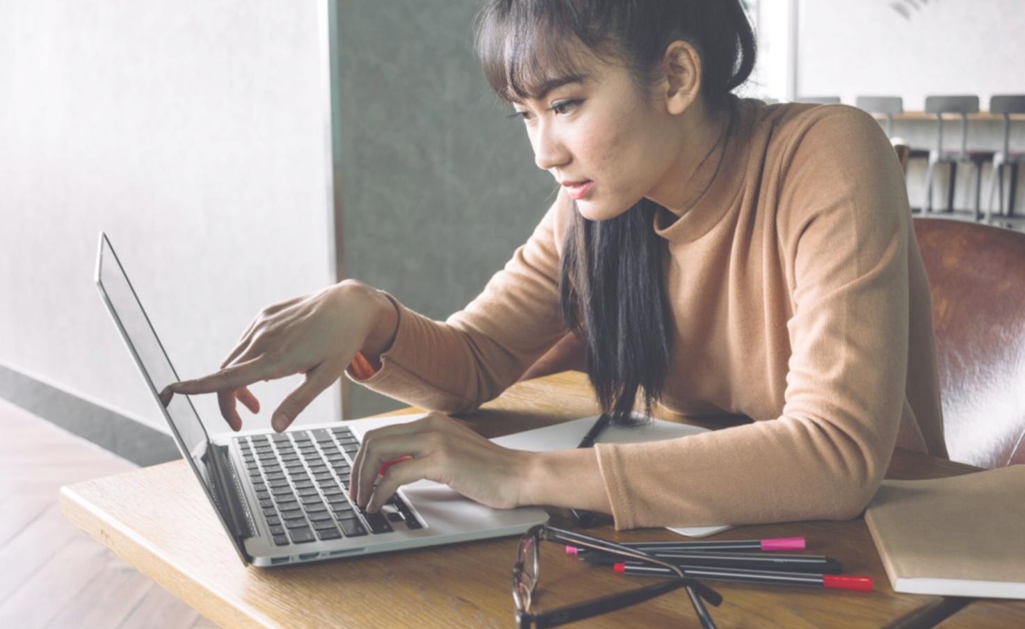 Students collaborating on coding projects during front-end development program